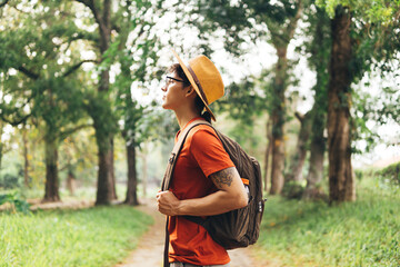 Portrait of young Hispanic hiker enjoying nature in forest.