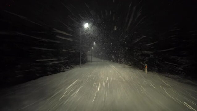 On a night winter road in a snow storm