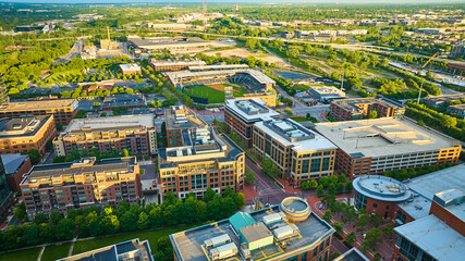Golden light on landscape and buildings with Columbus Clippers stadium in aerial over Ohio
