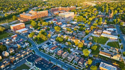 Golden glow sunrise houses, businesses, factory cityscape landscape neighborhood aerial