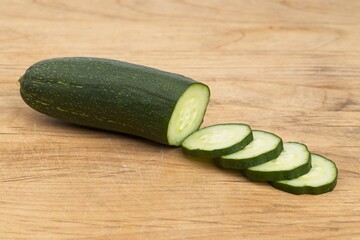 Cucumber slices on cutting board.