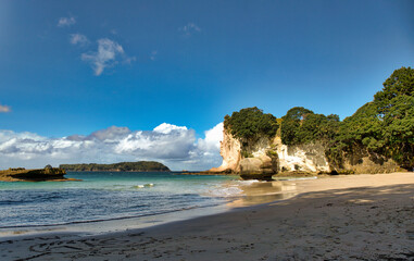 The golden beach and stunning  rock formations and archway  at Cathedral cove in the Coromandel NZ