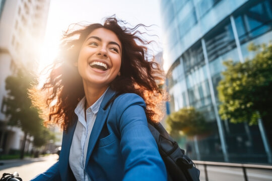 A joyful woman riding her bicycle to work on a sunny morning, an eco-friendly and healthy lifestyle concept