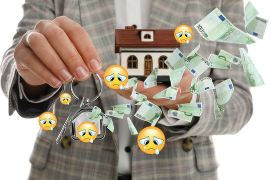 Woman with keys and house model on white background, closeup. Crying face emoji illustrations and flying euro banknotes symbolizing buyer's remorse