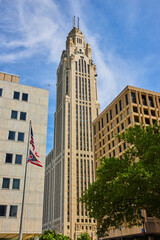 Fototapeta na wymiar American and Ohio flags with LeVeque Tower in background