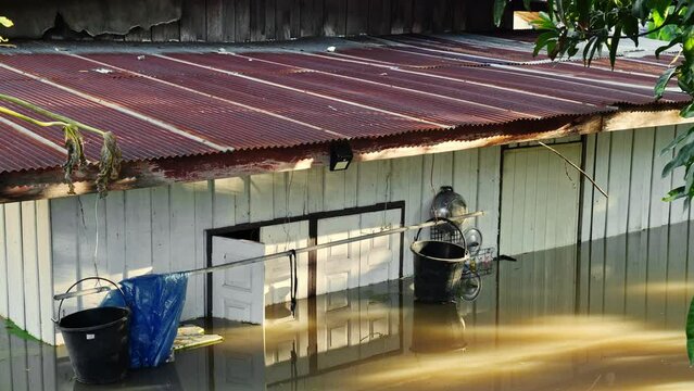 Flooding in community areas in Thailand,Water from the river flooded the house.