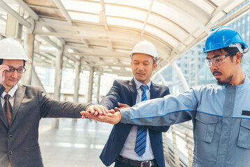 Group of multiracial people Teamwork meeting join hands Engineer Manager Foreman fist bump together. Close up diversity engineer people hands partner teams. Business connection team join partnership