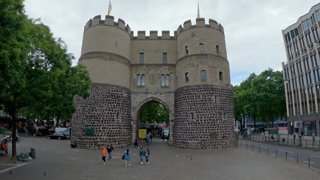 Aerial shot of Hahnen Gate on Rudolf Platz square in Cologne, Germany, slow motion