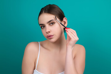 Beautiful woman with mascara eyebrows hold eyebrow brush. Eyebrows lamination. Brow beauty...
