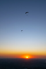 Naklejka na ściany i meble Paragliding during sunset. Pedra Grande, located in Atibaia, Brazil