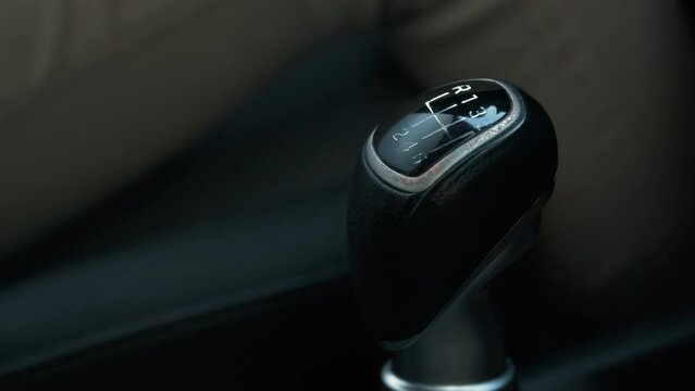 Switching The Car Gear From One To Six. Detail Shot of Unrecognizable Driver's Hand. Driving on Outdoor.