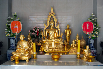 Group of buddha statue enshrined in Thai temple.