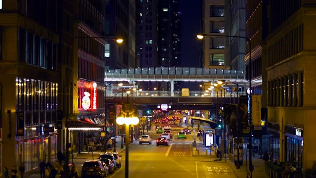 Night city time lapse with cars and trains. Chicago.