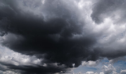 Naklejka na ściany i meble Dark sky with stormy clouds. Dramatic sky ,Dark clouds before a thunder-storm.