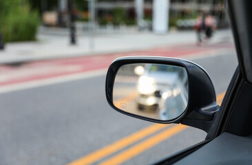 Car mirror reflects life's journey, symbolizing reflection, hindsight, self-awareness, and the road...