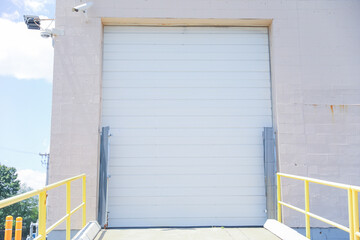 closed garage door symbolizes security, privacy, and hidden potential. The mundane facade conceals...