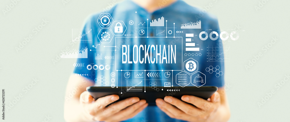 Poster blockchain theme with young man using a tablet computer