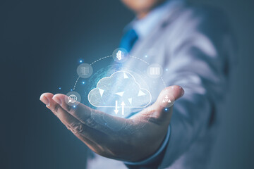 Businessman hand holding access cloud computing technology. Data storage security online in Networking and internet service. Connect devices to cloud. Cloud computing concept.