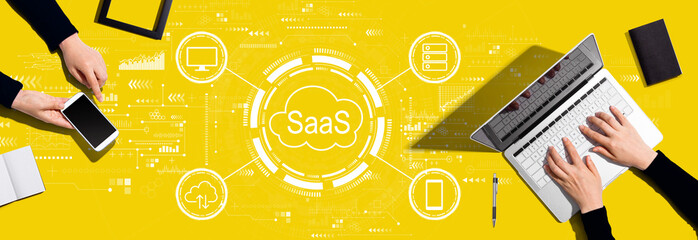 SaaS - software as a service concept with two people working together