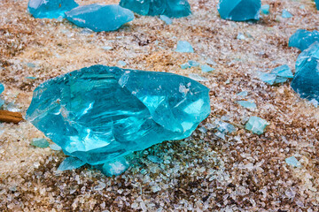 Clear glass fragments with prism of turquoise and sky blue broken glass shards