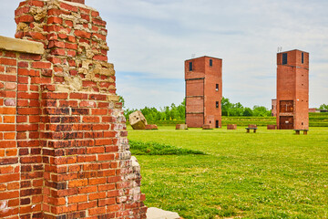 Broken and decaying abandoned factory with partial wall and stand alone freight elevators