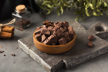 Pieces of natural milk chocolate. Natural products, artisan chocolate.