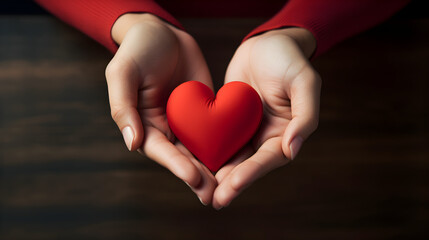 Fototapeta premium Young women hands holding red heart,health care, donate and family insurance concept,world heart day, world health day, CSR responsibility, adoption foster family, hope, gratitude, kind. Generative ai