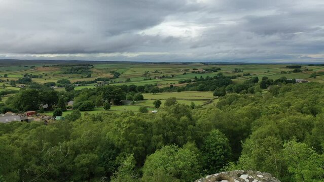 Aerial footage flying backwards over the Druids writing desk at Brimham Rocks, North Yorkshire.