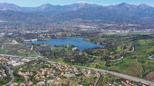 Aerial view of the Puddingstone Reservoir with Los Angeles area cityscape