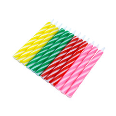 Colorful birthday red pink yellow green spiral candles isolated on white background