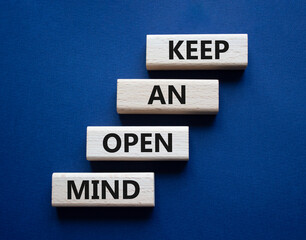 Keep an open mind symbol. Wooden blocks with words Keep an open mind. Beautiful grey green background. Business and Keep an open mind concept. Copy space.