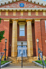 Vertical front entrance to Knox County Ohios courthouse with large marble pillars