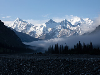 Snow-capped mountains above the morning mist