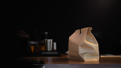 Food delivery inside ghost kitchen during quarantine. Take away paper bag meal for online order....