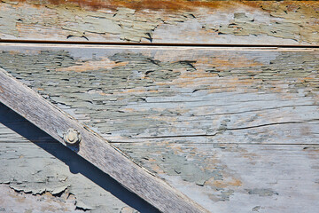 Cracked, splintered, wood wall, gray fading paint, slanted plank, triangle corner