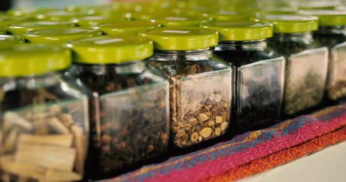 Various seeds and spices in jars, 4k, slomo