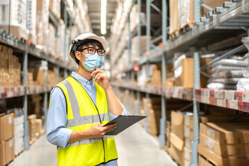 Portrait engineer worker labor asian man use tablet shipping order detail check goods and supplies on shelves with goods background inventory in factory warehouse.logistic industry and business export