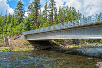 Stairs lead to the Deschutes River beneath the Highway 42 bridge near La Pine, Oregon, USA