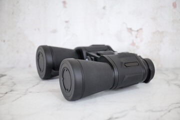 Binoculars on an isolated white background. Zoom binocular for astronomy observation or military 