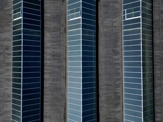 Fototapeta na wymiar ceiling windows on the flat roof of an industrial building or shopping center.stripes of skylights a triangle of production operations. warehouse with overhead lighting. ventilation, markerlting