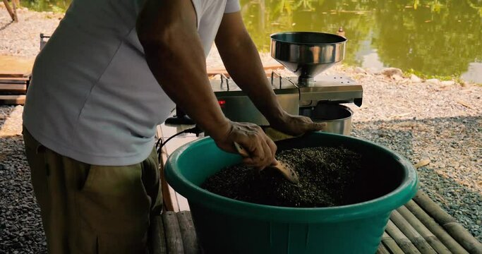 closeup of Asian man mixing seeds such as pumpkin seeds, gunks, cur, cumin. Slowmo, 4k