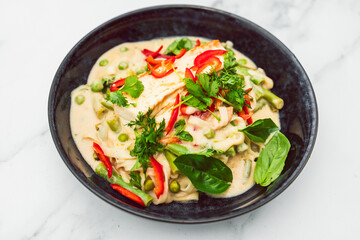 Fototapeta na wymiar plant-based creamy vegetable curry with silken tofu