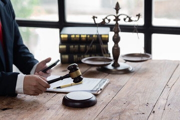 Male business man lawyers working with contract papers at the law firms. Judge gavel with scales of justice. Legal law, lawyer, documents, advice and attorney, court judge, concept.