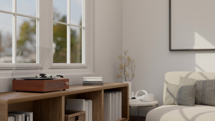 A vintage vinyl record player on a wooden shelf in a cozy Scandinavian living room.