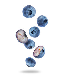 Ripe whole and sliced blueberries close up in the air on a transparent background