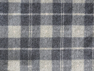 Fleece texture background with plaid pattern of grey dark gray and light grey colors. Grey fleece...