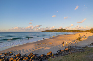Sunset view towards the lighthouse from Main Beach in Byron Bay, New South Wales, Australia