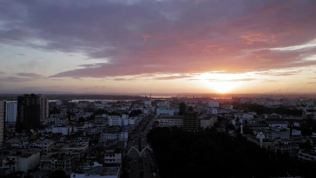 Aerial drone stock footage wide shot of Mombasa city sunset