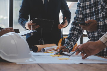 Engineer Teamwork Meeting, Drawing working on blueprint meeting for project working with partner on model building and engineering tools in working site, Construction and structure concept.