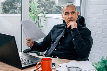 Fototapeta premium portrait of mature businessman in office
